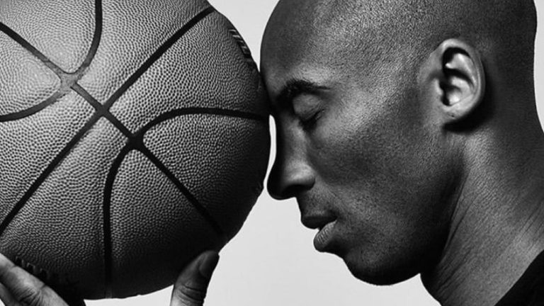 Kobe Bryant with basketball, black and white