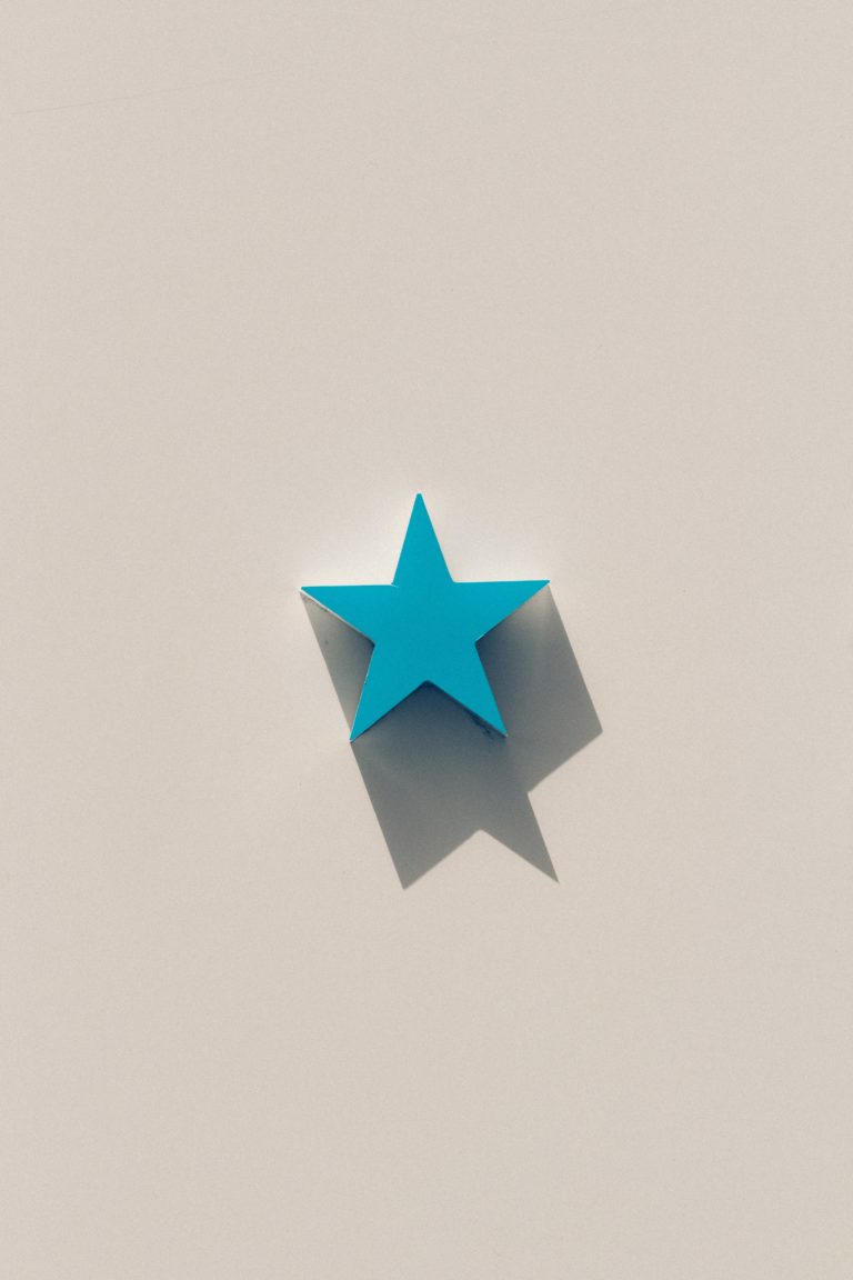 Wooden blue star on a stark background